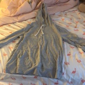 This is a button up hoodie, it’s a medium and it was made in Cambodia